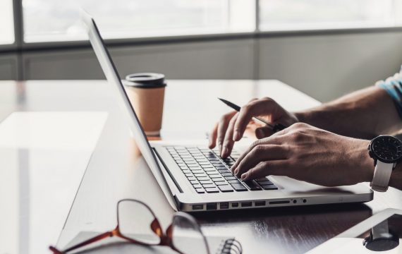 Journalist or businessman working in office. Panoramic banner. Entrepreneur, planning, journalism, development, finance, business strategy concept